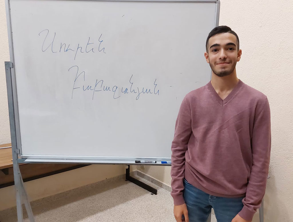 armenian student writes his name in armenian